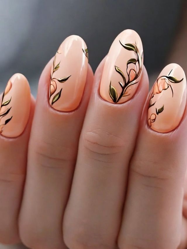 A woman's nails with floral designs on them.