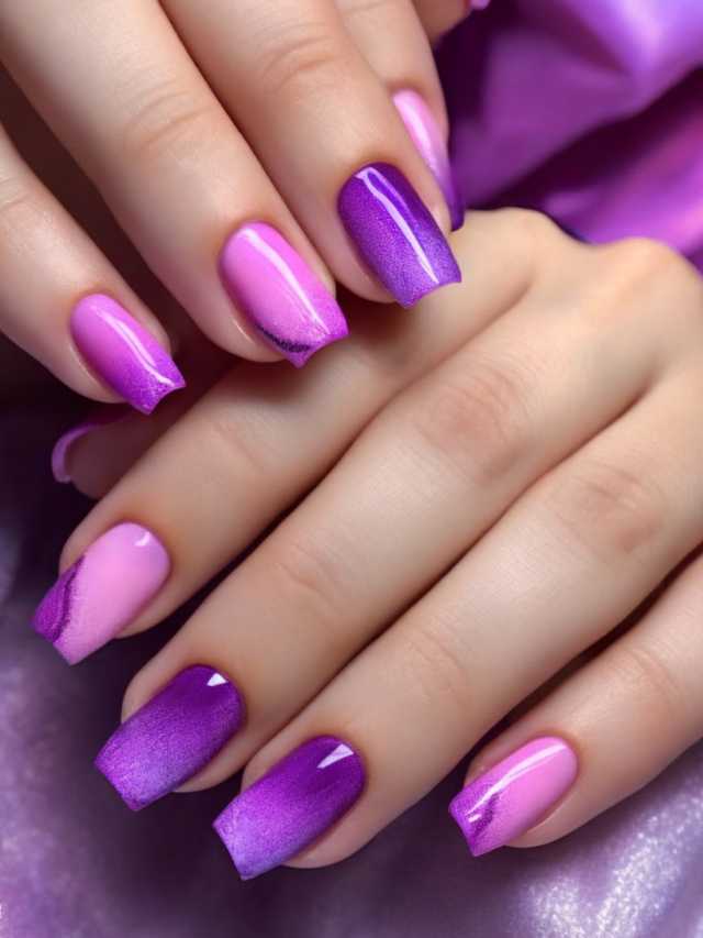 A woman's hand with purple and pink nails.