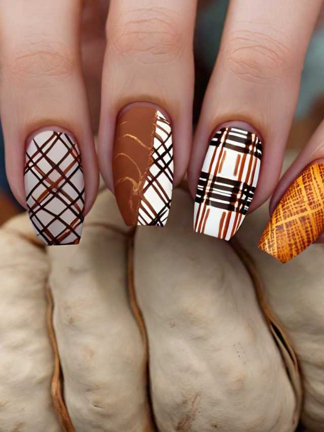 A woman's nails are decorated with plaid designs.