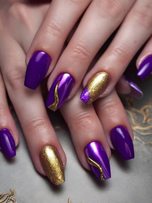 Purple and gold nails on a woman's hands.