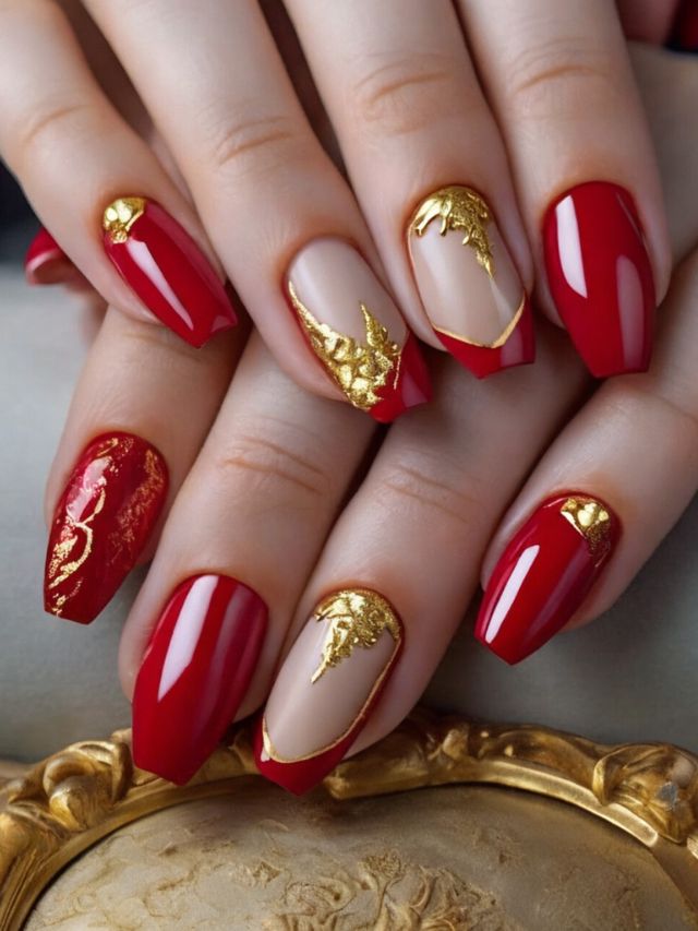 A woman's hand with stunning red almond nail designs.