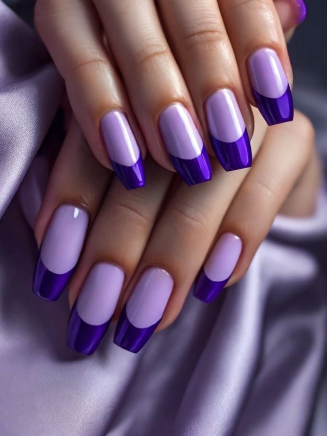 A woman's hand with purple and white nails.