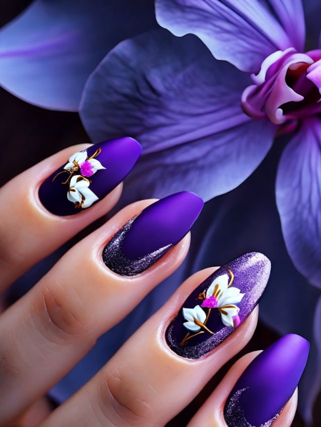 A woman's hand with purple nails and flowers.