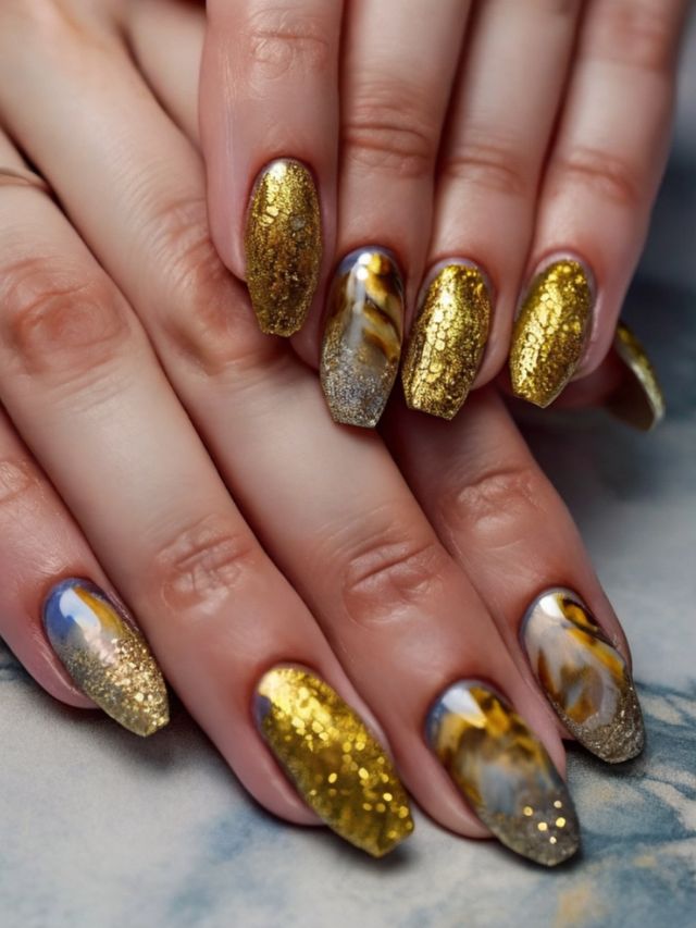 A woman's hands with gold and silver nails.
