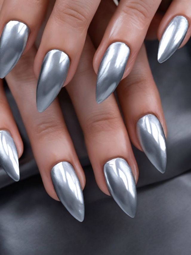 A woman's silver nails on a black background.