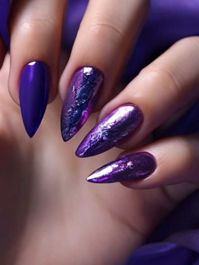 A woman's hand with purple and silver nails.