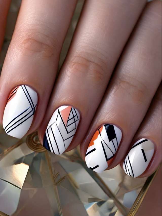 A woman's nails with geometric designs on them.