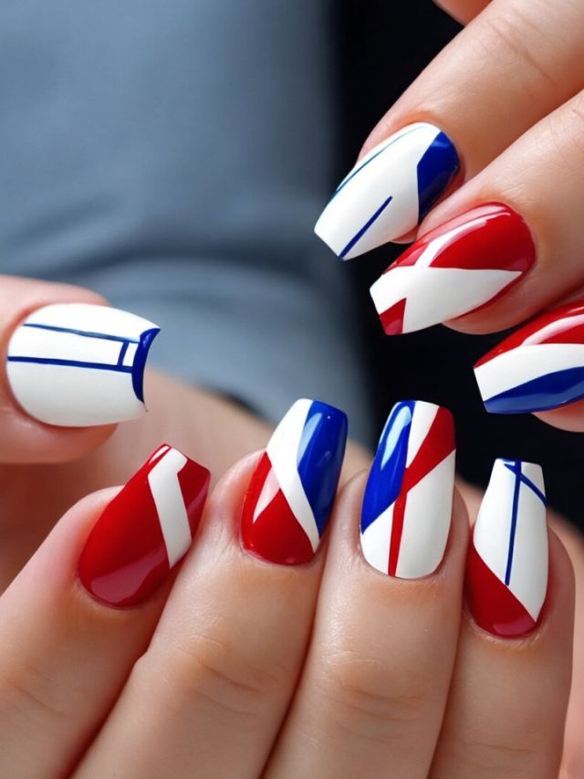 A woman's nails with red, white and blue Buffalo Bills-inspired designs.