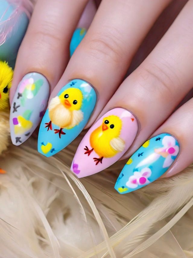 Easter-themed acrylic nails with painted chickens.