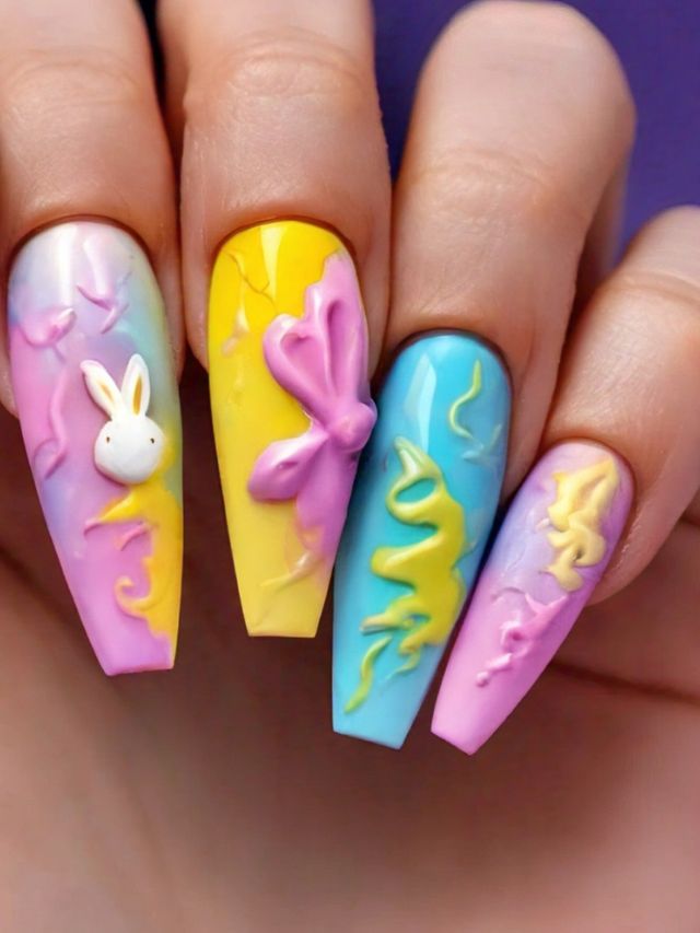 An Easter-themed hand with acrylic nails.