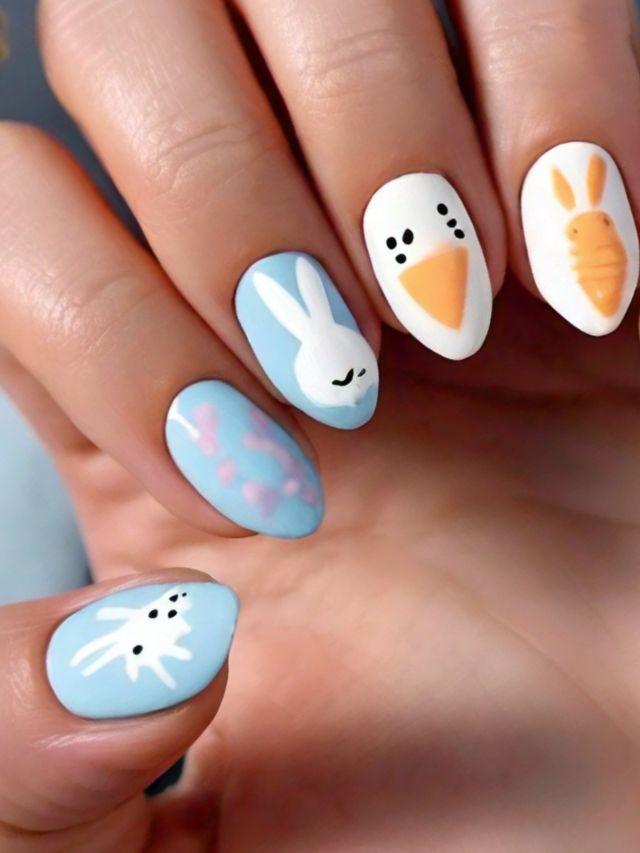 An Easter-themed hand with beautifully painted acrylic nails.