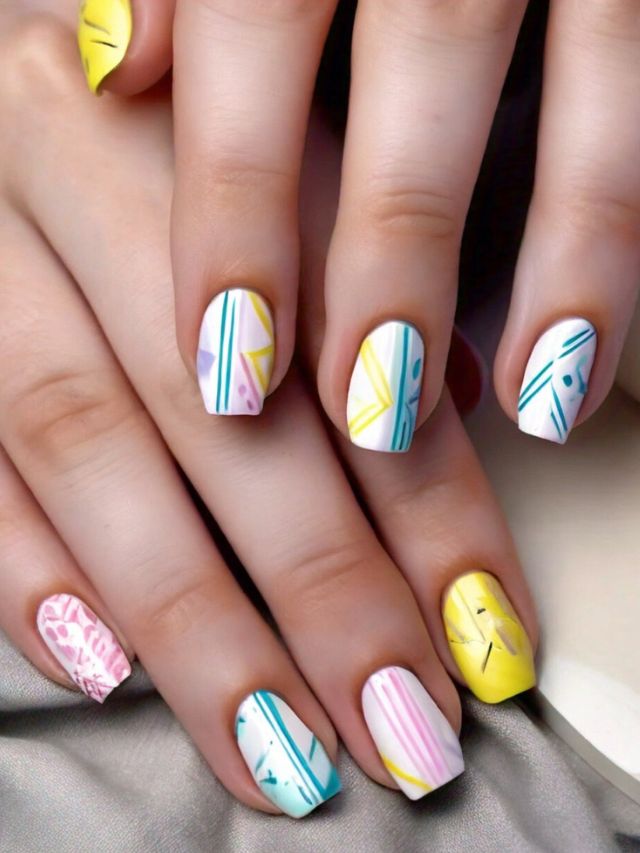 A close up of Easter nail art with acrylic nails.