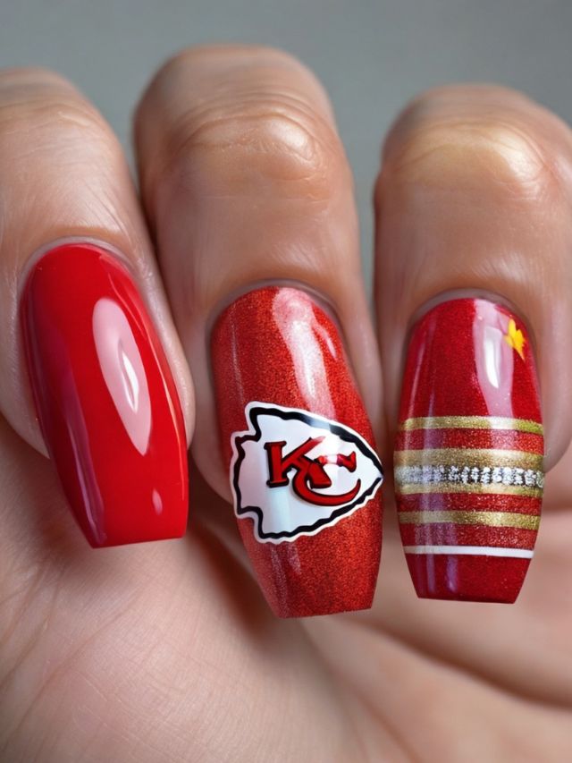 A hand with Kansas City Chiefs nail design.