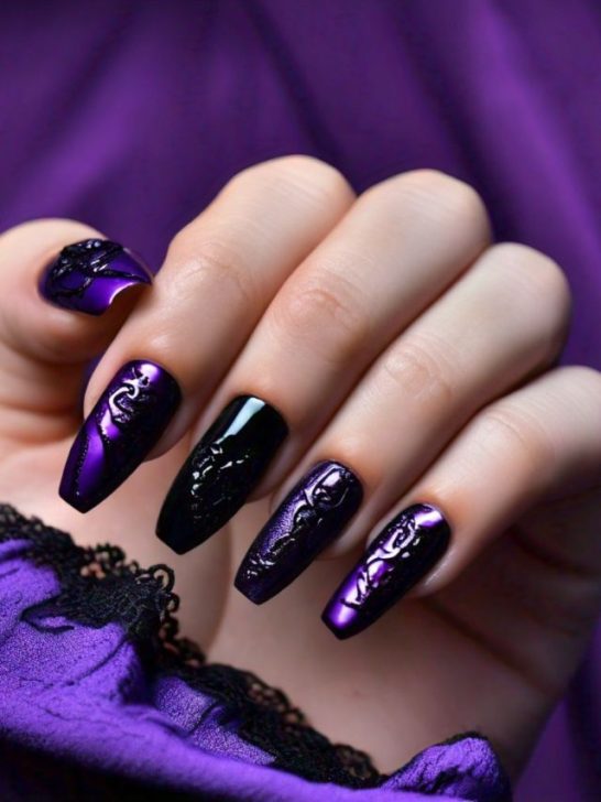 Gothic nails with black and purple nails.
