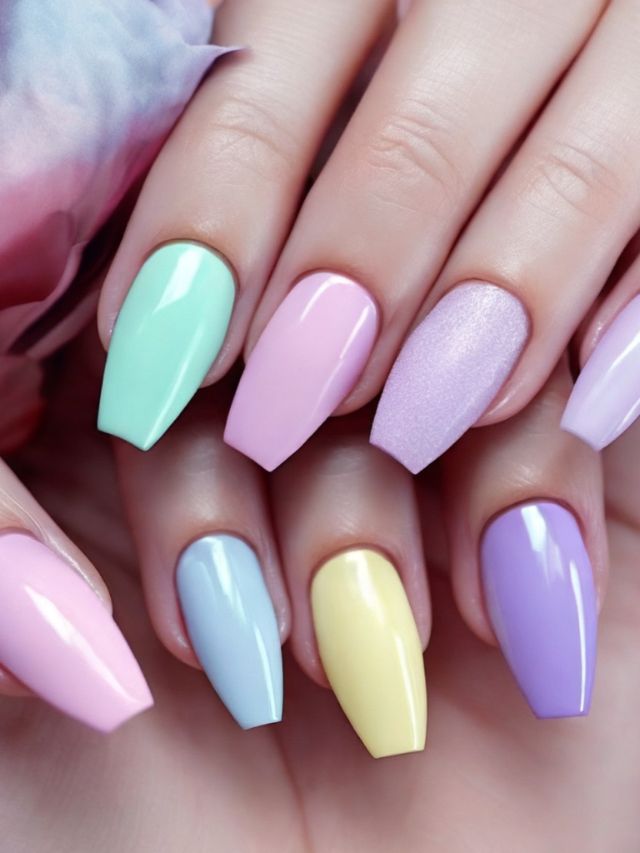 A woman's hand with pastel colored nails.