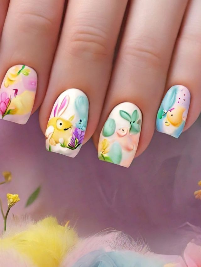 A woman's nails are adorned with delicate flower designs, perfect for the Easter season.