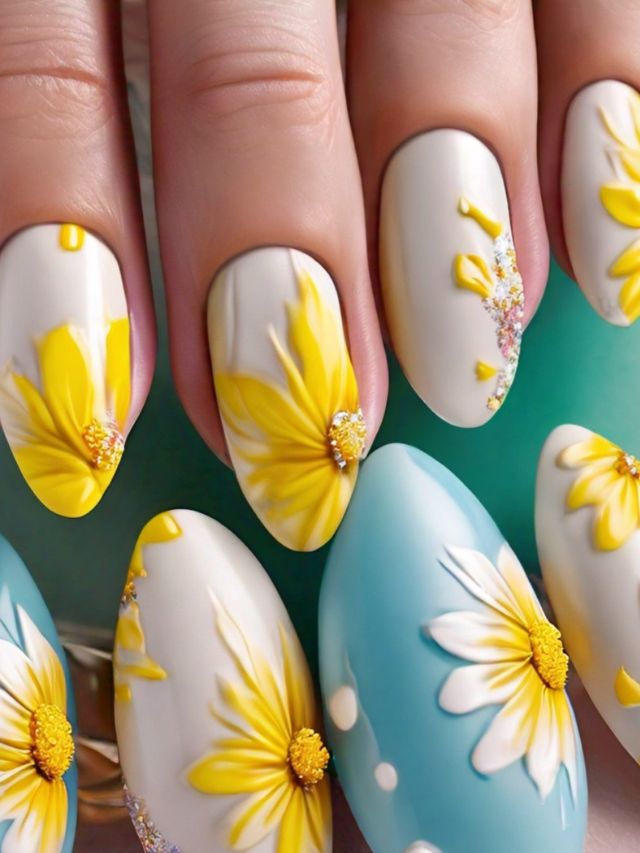 A woman's nails with cute yellow and blue flower designs, perfect for Easter.