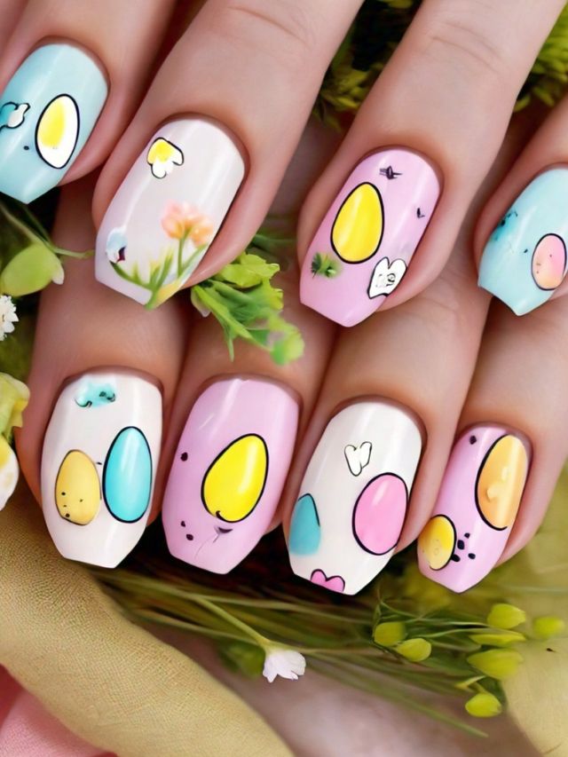A woman's nails are adorned with vibrant Easter egg-inspired nail designs.