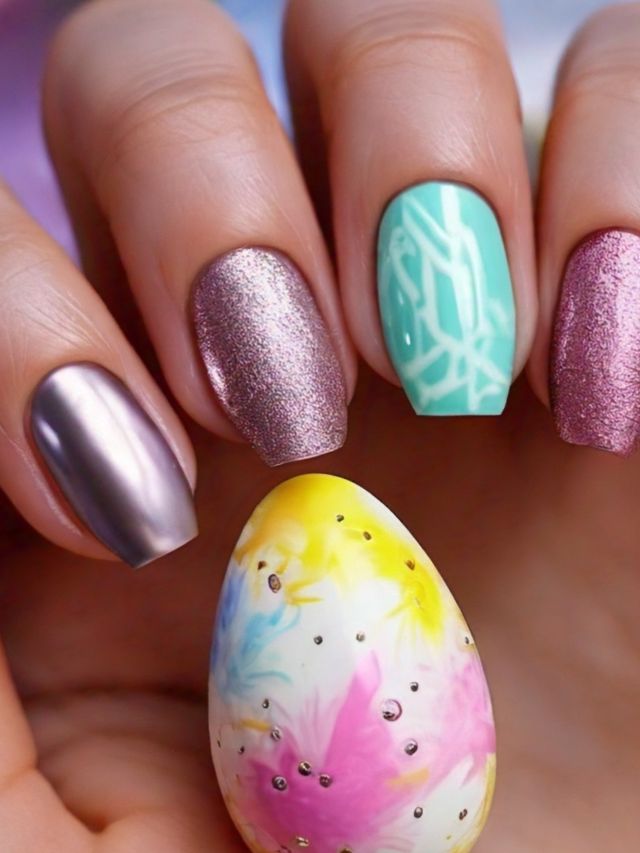 A woman is holding an Easter egg, showcasing her inspiring nail color design.