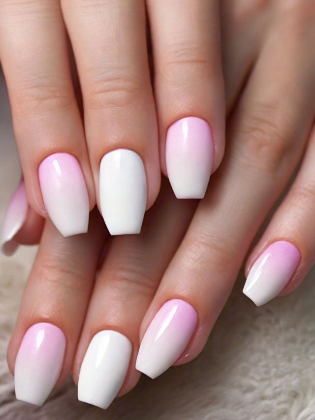 A woman's hands showcasing a vibrant nail color with pink and white ombre.