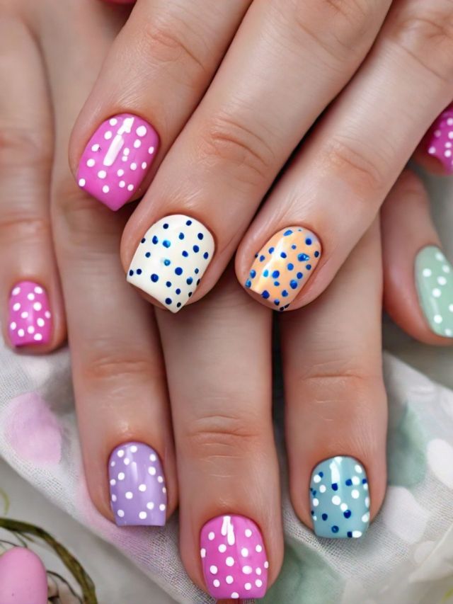 A woman's hands with Easter-inspired, colorful polka dot nails.