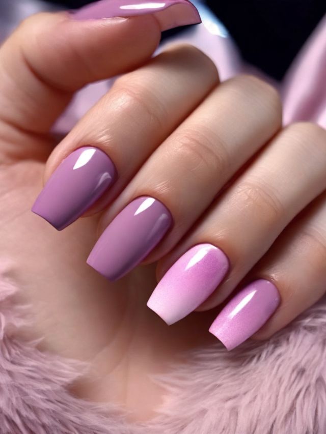 A woman's hand with pink and purple nails.