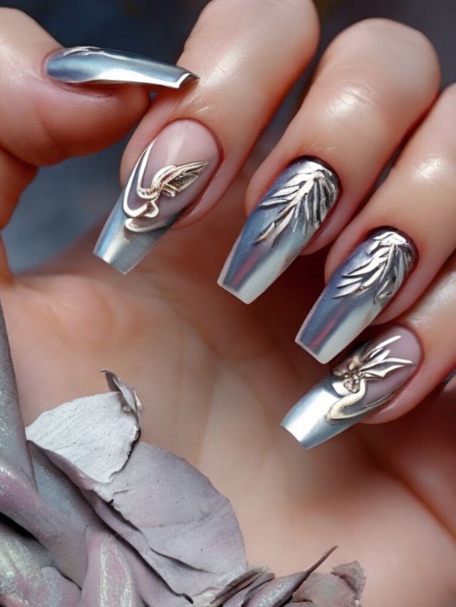 A woman's nails adorned with stunning silver and gold designs, showcasing innovative Angel Nail ideas.