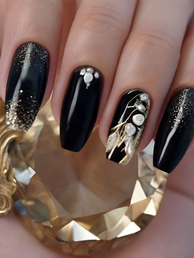 Black and gold nails with pearls and diamonds.