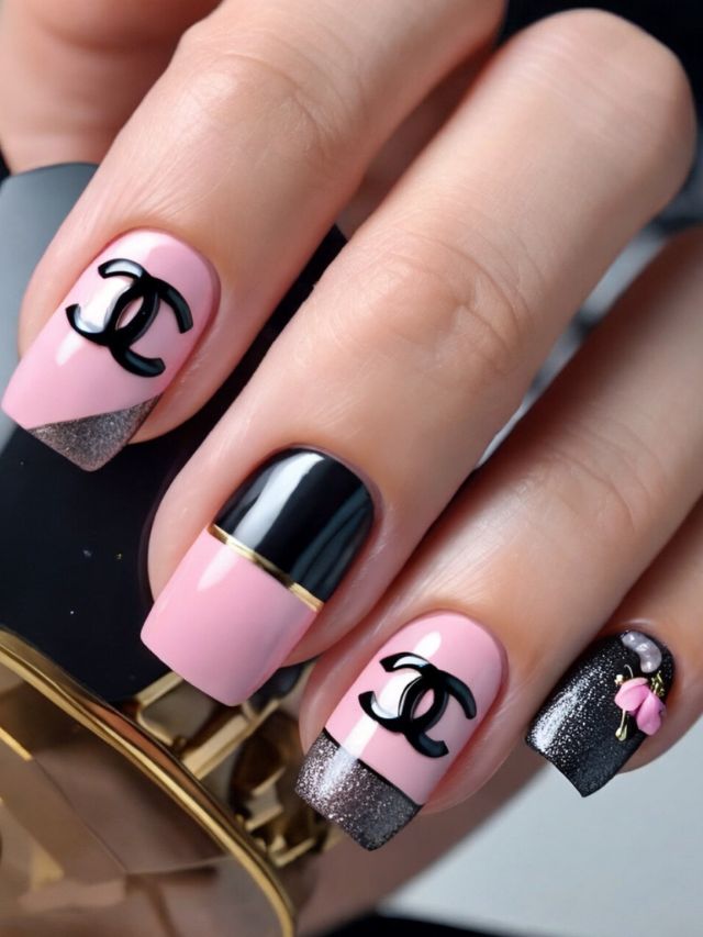 Chanel nails with black and pink accents.