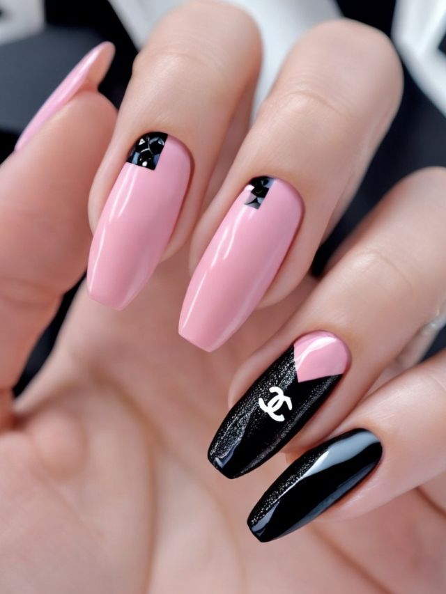 Pink and black nails with Chanel logo featuring cute fall toe nail design.