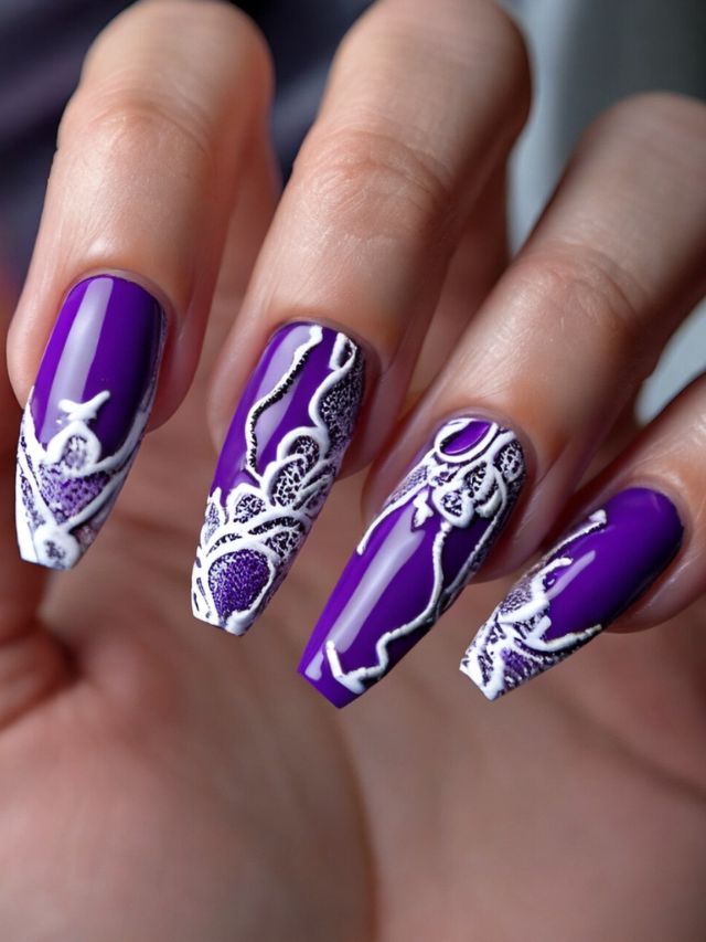 Beautiful purple nails with lace designs.