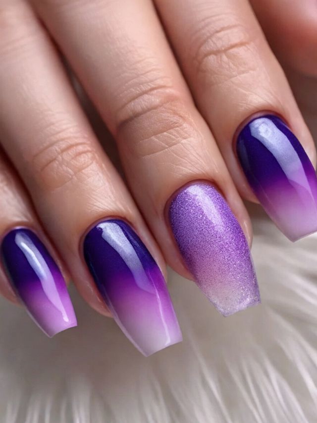 A woman's hand flaunting a stunning purple and white ombre nail design, perfect for a wedding.