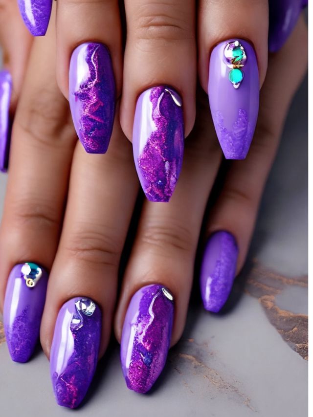 Beautiful purple nails with marble designs.