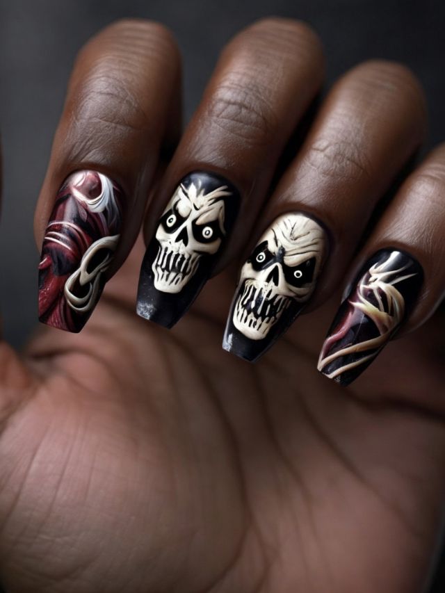 A woman's nails are decorated with skull nail designs.