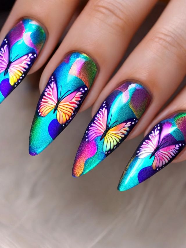 A woman's nails with colorful butterflies on them.