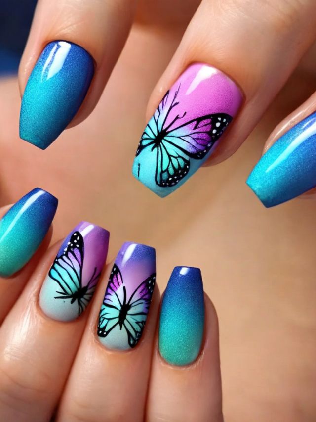 A woman with blue and purple nails with butterflies on them.