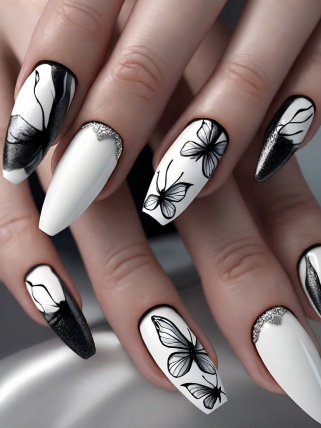 Black and white nails with butterfly designs.