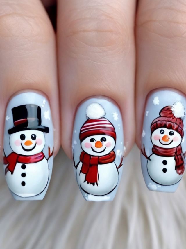 A woman's nails are decorated with snowmen and hats in lovely nail designs.