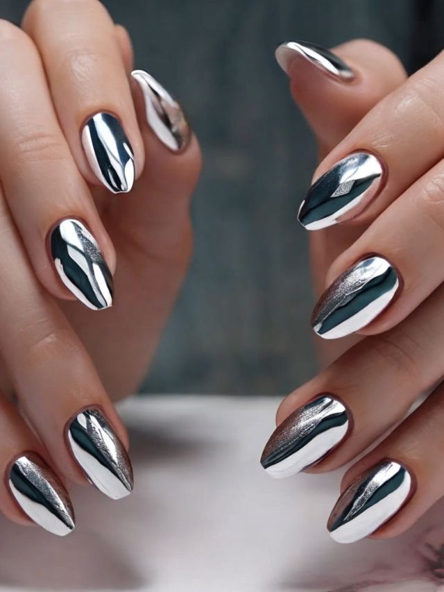 Stunning mirror nail design ideas showcased on a woman's hands with silver nail polish.