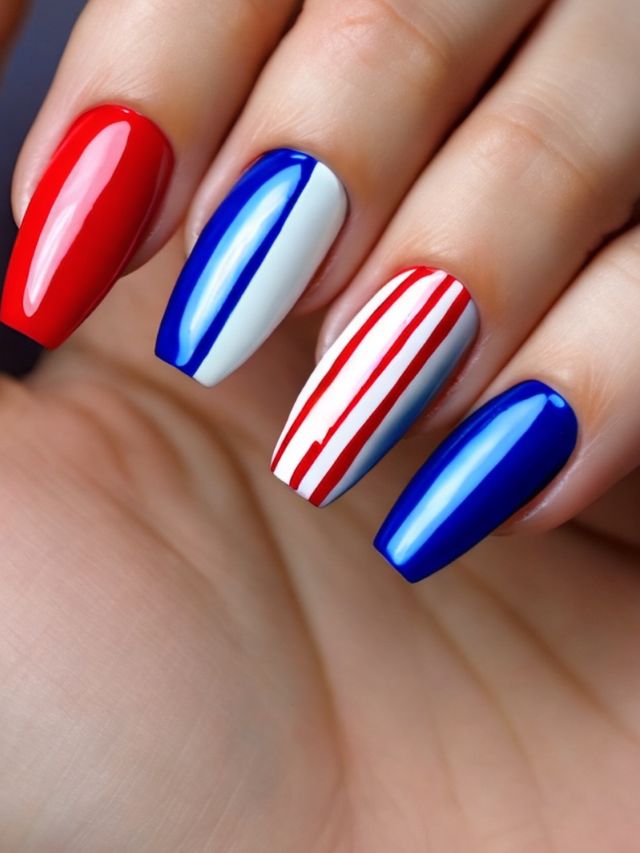 A woman's nails with red, white and blue designs inspired by Buffalo Bills.
