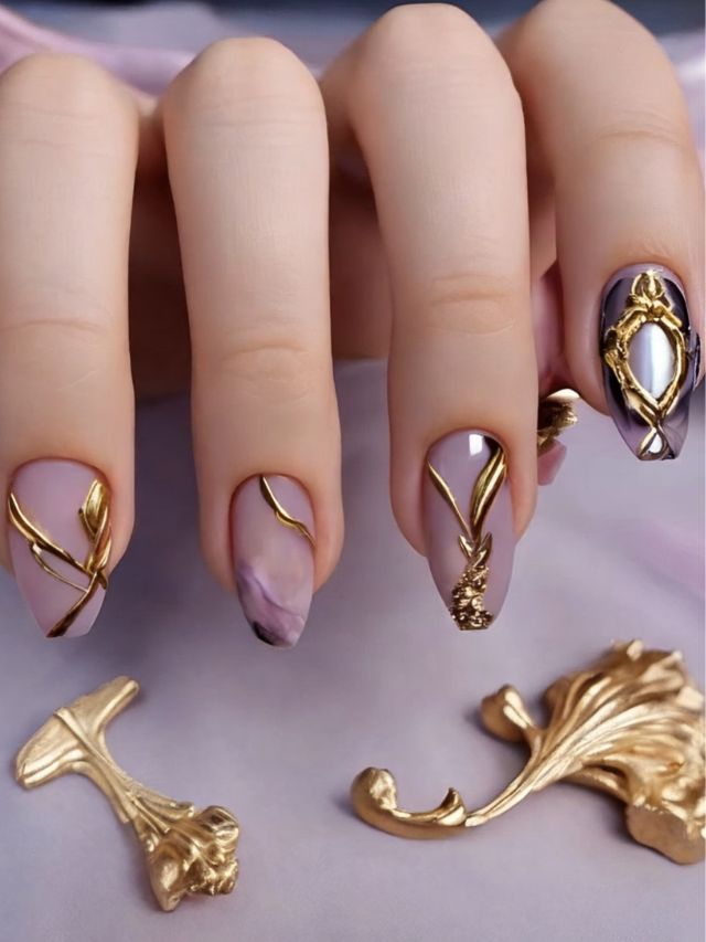A woman's nails are creatively adorned with glamorous gold nail art featuring mirror nail designs.