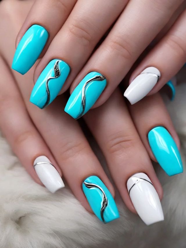 A woman's hand with blue and white nails.