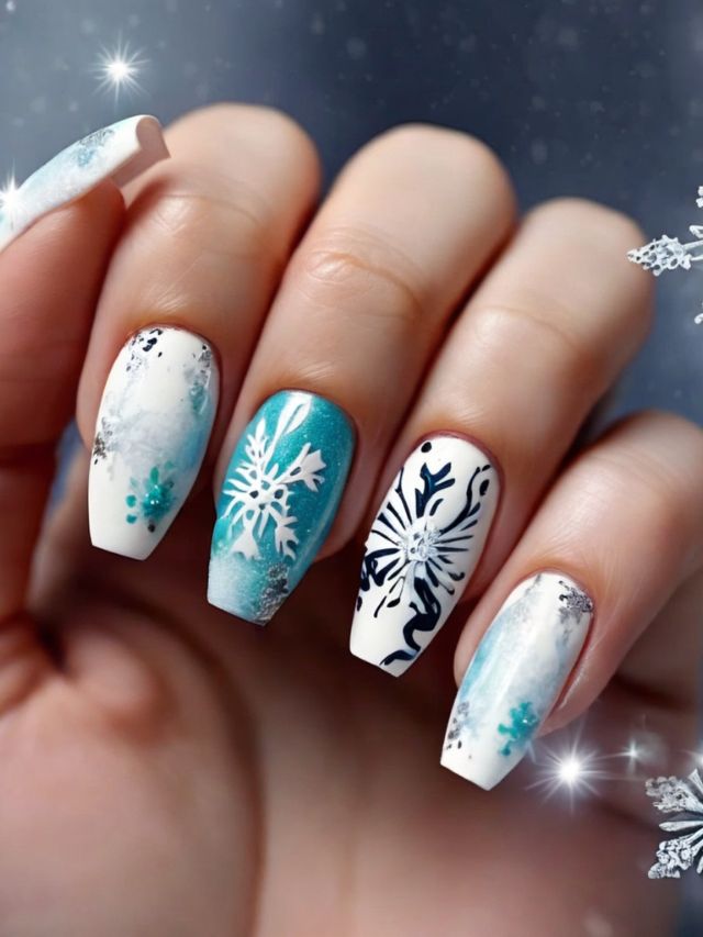 A woman is holding up her nails with snowflakes on them.