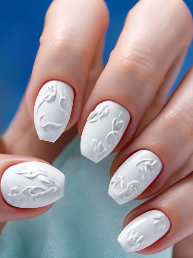 A woman's hand with cute white nail art, perfect for Easter.