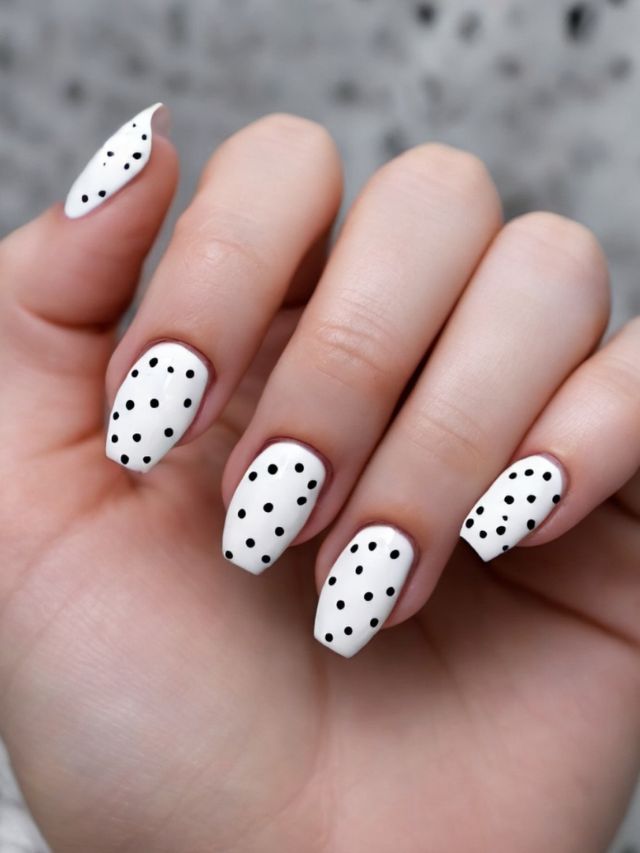 Cute white polka dot nail art perfect for Easter.